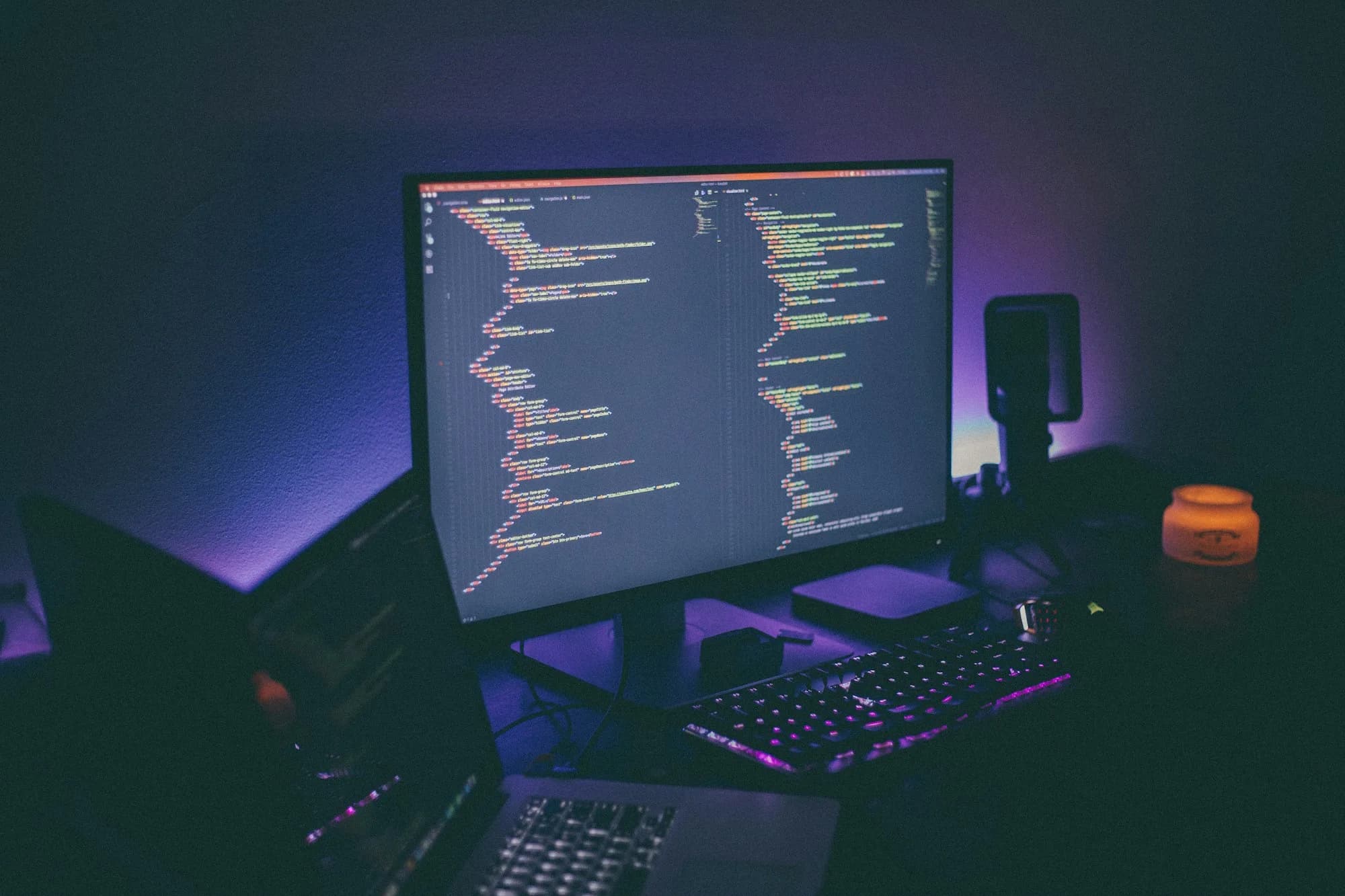 A real computer workstation with a website being developed on screen