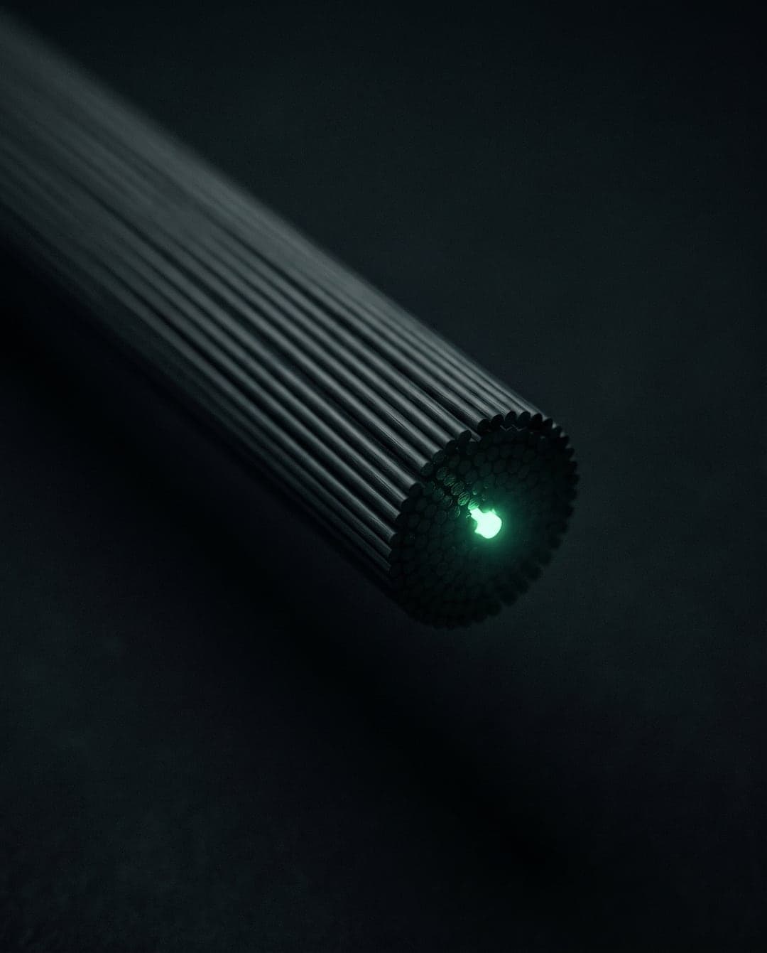 Macro view of ordered fibre optic strands in darkness